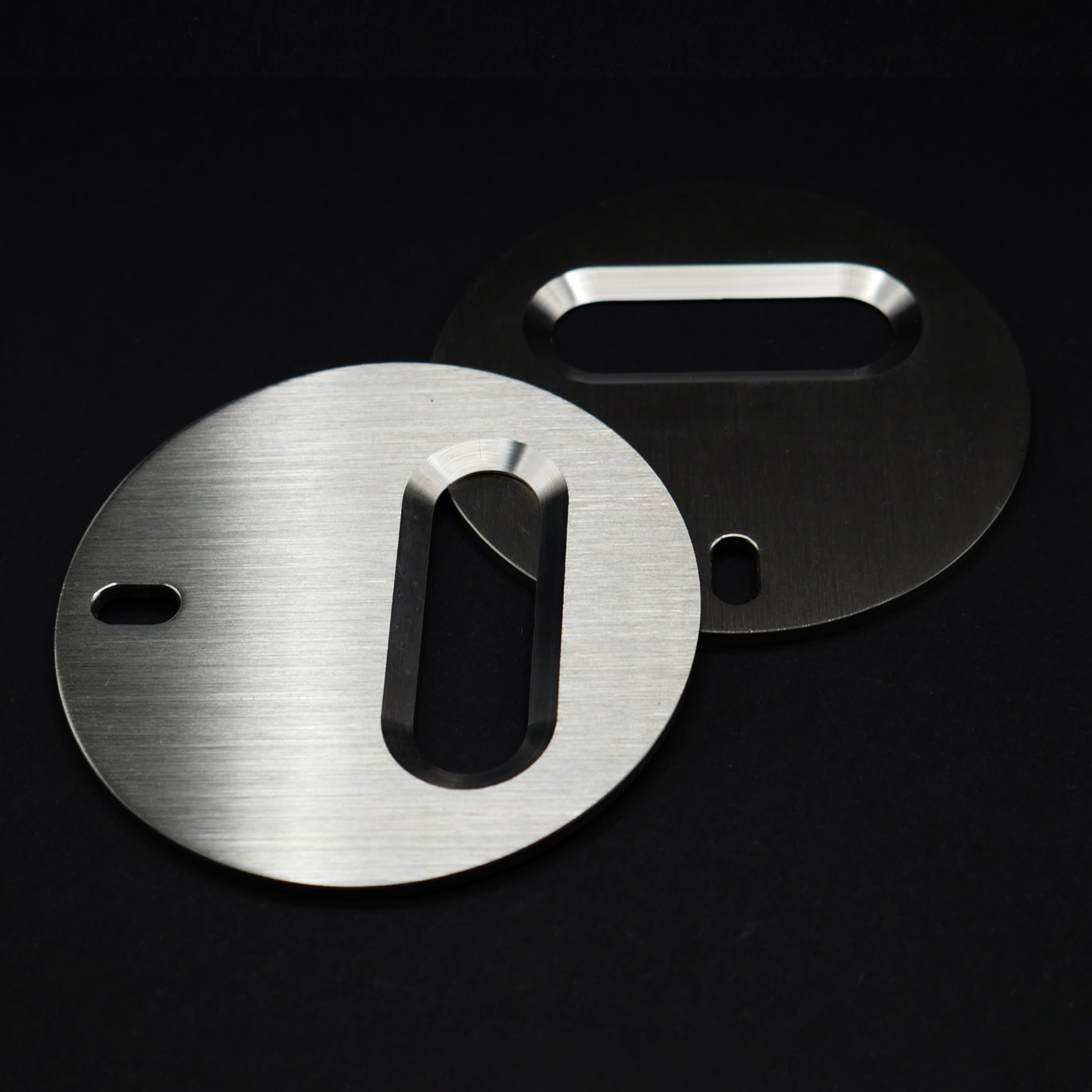 Two stainless steel circle bottle openers