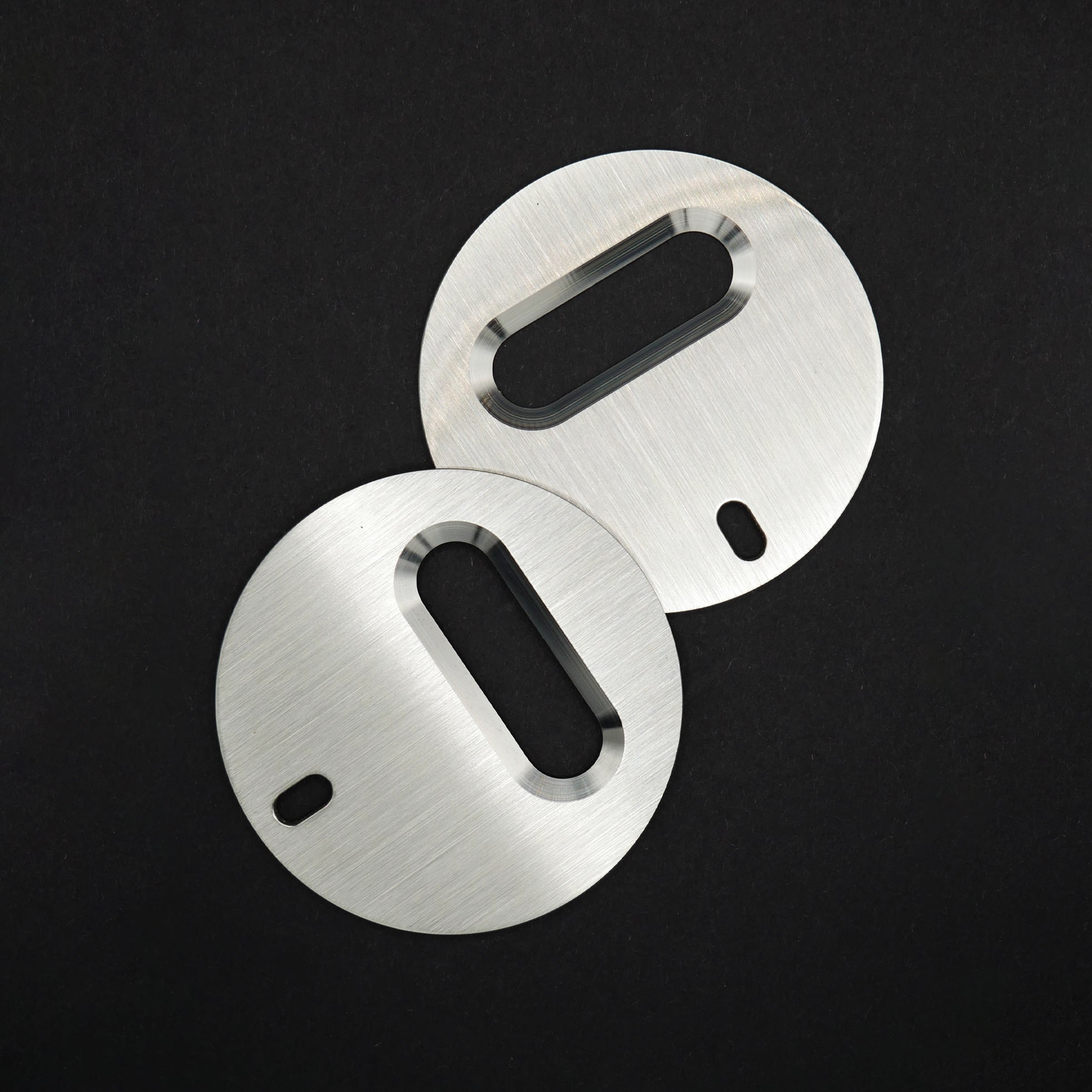 Two stainless steel circle bottle openers