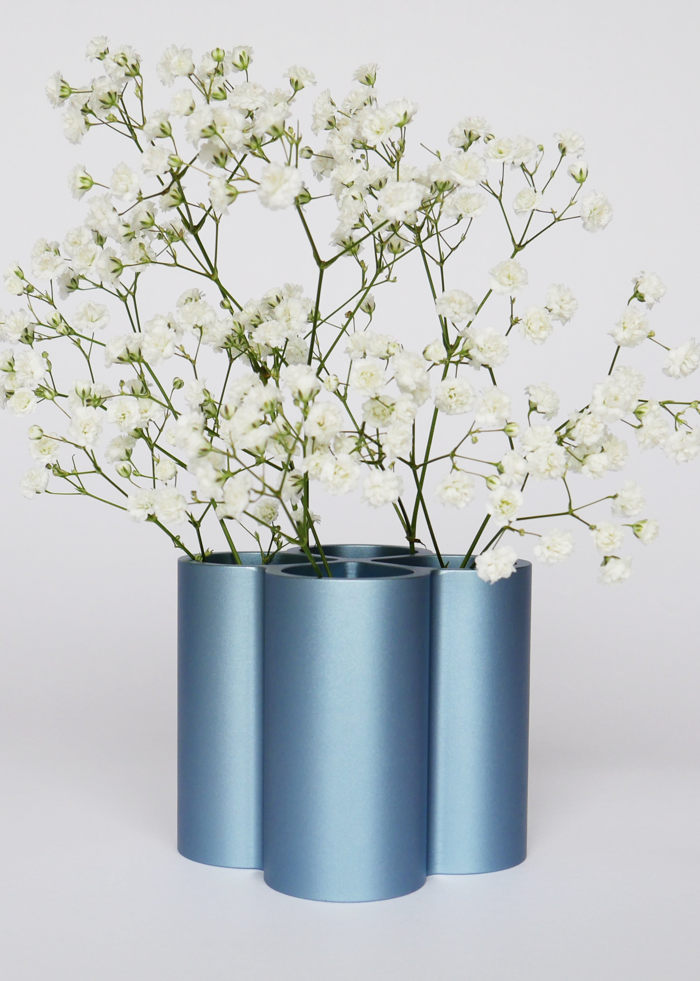 Blue metal vase with flowers